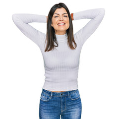 Poster - Beautiful brunette woman wearing casual clothes relaxing and stretching, arms and hands behind head and neck smiling happy