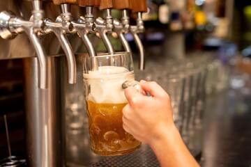 Pouring beer from tap