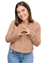 Canvas Print - Young beautiful woman wearing casual clothes hands together and fingers crossed smiling relaxed and cheerful. success and optimistic