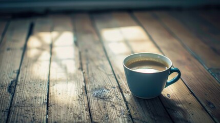 Sticker - A coffee cup resting on wooden flooring