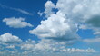 © artifex.orlova - Majestic amazing sky. Blue sky white clouds. Clouds rolling under blue sky. Time lapse.