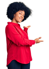 Poster - Young african american girl wearing casual clothes inviting to enter smiling natural with open hand