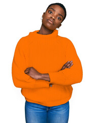 Poster - Young african american woman wearing casual clothes relaxed with serious expression on face. simple and natural looking at the camera.