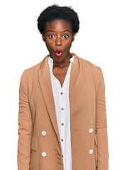 Sticker - Young african american girl wearing business clothes scared and amazed with open mouth for surprise, disbelief face