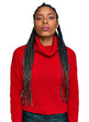 © Krakenimages.com - African american woman wearing casual winter sweater relaxed with serious expression on face. simple and natural looking at the camera.