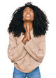 © Krakenimages.com - Young african american girl wearing casual clothes begging and praying with hands together with hope expression on face very emotional and worried. begging.