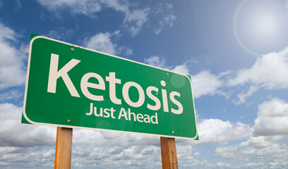 Wall Mural - Ketosis Just Ahead Green Road Sign Over Clouds and Blue Sky.