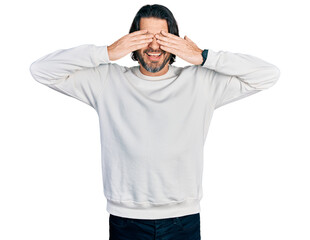 Wall Mural - Middle age caucasian man wearing casual clothes covering eyes with hands smiling cheerful and funny. blind concept.