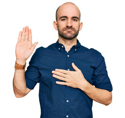 Sticker - Young hispanic man wearing casual clothes swearing with hand on chest and open palm, making a loyalty promise oath