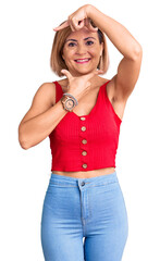 Poster - Young blonde woman wearing casual clothes smiling making frame with hands and fingers with happy face. creativity and photography concept.