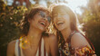 © Jhati - Two women smiling and laughing in sunlight