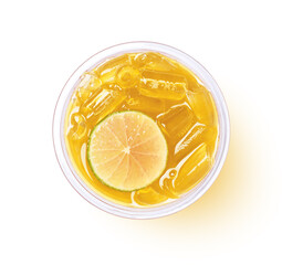 Sticker - Glass of yellow chrysanthemum tea or Chinese ice tea with lime slice isolated on white background with clipping path, top view, flat lay.