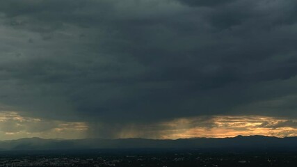 Wall Mural - timelapse of clouds over a mountain with dramatic sky, nature environment dark huge cloud sky black 