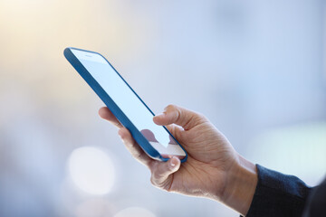 Business person, hands and typing with phone for social media, research or browsing news at office. Closeup of user or employee on mobile smartphone for online chatting, texting or app at workplace