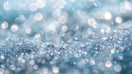 Fototapete - The image is a blurry blue background with many small, round, shiny, and reflective objects scattered throughout. Scene is calm and serene, as the reflective objects seem to be floating in the air