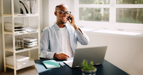 Happy African American businessman making a virtual call