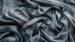 © Justlight - Muted gray fabric twirling in a hectic frenzy as if caught in a chaotic storm.