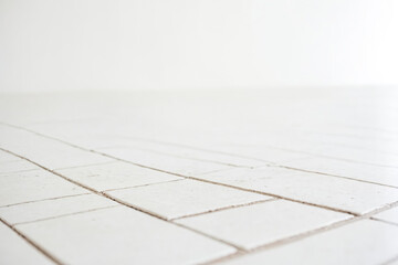 Sticker - White Tile Floor with Blurred Background