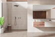 © ImageFlow - Tile home bathroom interior with sink and glass shower, accessories on drawer