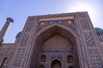 The building has a blue and white design. The blue and white colors are very bright and stand out against the blue sky