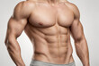 © songsakpandet - Attractive male torso closeup isolated on white background.