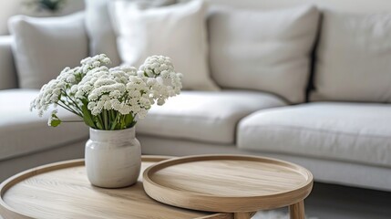 Wall Mural - elegant living room with a wooden coffee table displaying a vase of beautiful white flowers. simple 