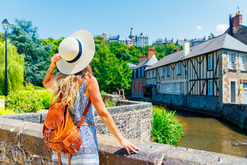 Wall Mural - Woman tourist in typical village in Brittany- France