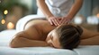 © Katsiaryna - Young woman having back massage in spa salon. Beauty treatment concept.