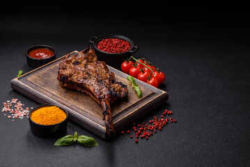 Wall Mural - Juicy beef tomahawk steak on the bone baked on the grill