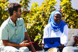 © ADDICTIVE STOCK - Diverse business meeting outside with Caucasian and Muslim woman