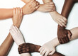 © NonVig/peopleimages.com - Hands, diversity and circle for synergy in studio with cooperation, commitment and teamwork with wrist grip. People, together and white background with support or solidarity, trust and collaboration