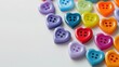 © AkuAku - Colorful Heart Shaped Plastic Buttons on White Background