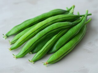 Wall Mural - A bunch of green beans on a light grey background