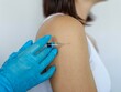 © Nadzeya - A Close Up Of A Person Receiving A Vaccine Injection In Their Shoulder