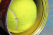 © Ralf - Closeup of unpacked yellow inner pressure tennis ball with white seam from vacuum sealed pack can