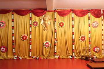 Wall Mural - indian stage decoration with golden yellow cloth backdrop