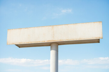 Wall Mural - Blank Billboard on a Blue Sky Background