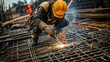 © pkproject - Construction Worker Welding Steel Rebar on Construction Site