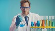 © Studio Nova - Scientist Holding Blue Liquid Flask