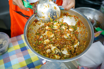 Wall Mural - Fresh Oysters salad saver with fried onions and acacia. Thai style seafood. Thailand local restaurant.