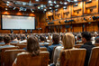 © antusher - Business conference presentation with crowd of people in auditorium seats