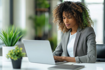 Wall Mural - Businesswoman using a laptop, white background,