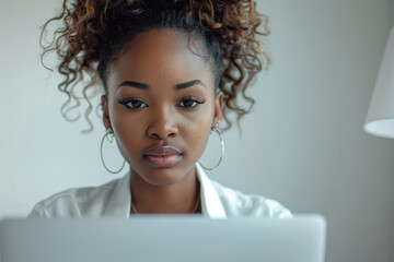 Wall Mural - Businesswoman using a laptop, isolated on a plain white background,