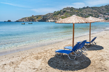 Wall Mural - View of the beach with chairs and umbrellas. Crete island landscape. 