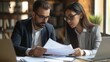 © AlfaSmart - Man and a woman reviewing documents together
