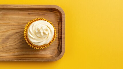 Canvas Print - Morning theme wood tray with white cupcake on bright yellow background