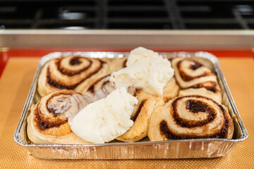 Wall Mural - Freshly Baked Cinnamon Rolls Cooling on Stove Top