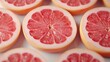 © JP STUDIO LAB - Close-up view of juicy halved grapefruits, pinkish-red interiors glistening under light, highlighting the freshness and vibrant color of the fruit segments