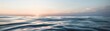 © May_Chanikran - Serene ocean waves at sunset, capturing the calming beauty of the horizon and the tranquil sea, with vibrant colors and gentle waves reflecting light.