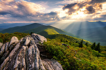 crepuscular rays highlighting summer foliage in the blue ridge mountains of north carolina